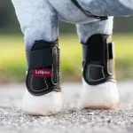 leieux-mini-toy-pony-capella-boots-black-lifestyle-angle.webp